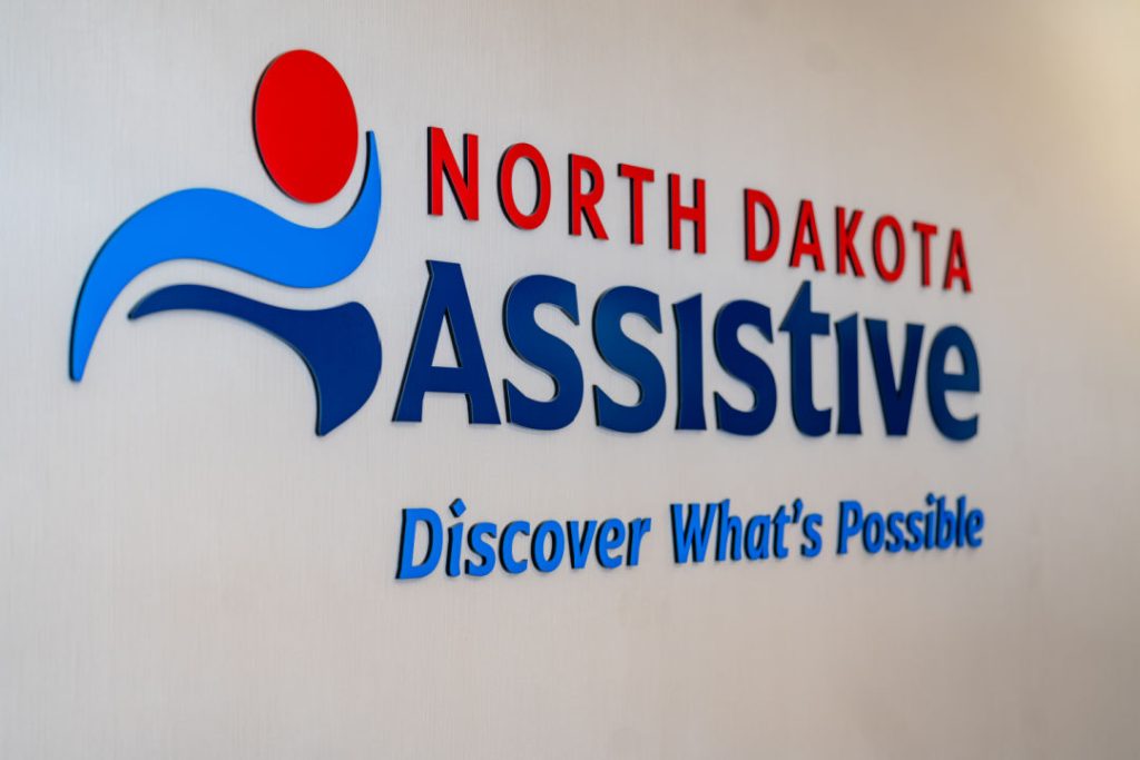 photo of sign on wall North Dakota Assistive