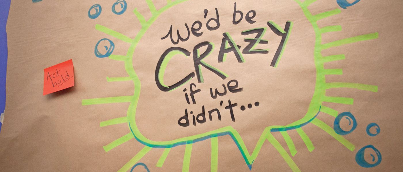 Illustration on brown butcher paper with colorful post-it notes that says "We'd be crazy i we didn't..."