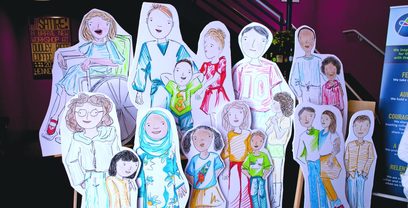 Cut out, life-sized drawings of a group of children