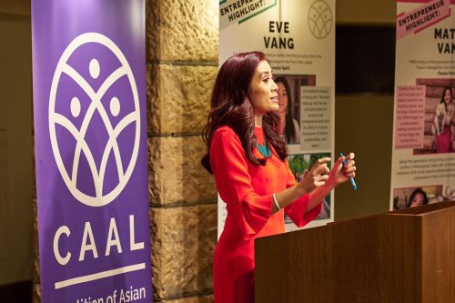 Woman speaking at a podium at Coalition of Asian American Leaders event