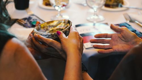 Close up of people's hands at Tiwahe Foundation event